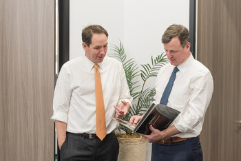 Nick Morrow and John Sheppard Reviewing Case Documents