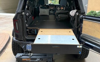 Ford Bronco Drawer Storage System for the Bronco. This image shows the optional Bamboo + Aluminum covers, and the sleeping platform.
