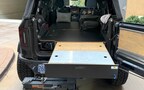 Ford Bronco Drawer Storage System for the Bronco. This image shows the optional Bamboo + Aluminum covers, and the sleeping platform.